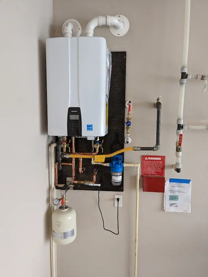 Professional plumber installing copper piping in a New Braunfels home